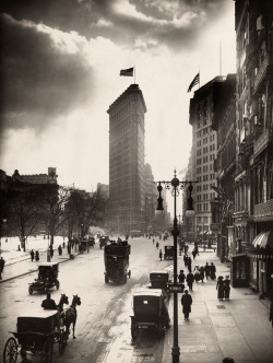 natgeofound:  Locals walk the streets of Madison Square near the Flatiron Building in New York City, July 1918. This photo and others from the National Geographic archives are being auctioned by Christie’s in an exclusive, online-only sale from July