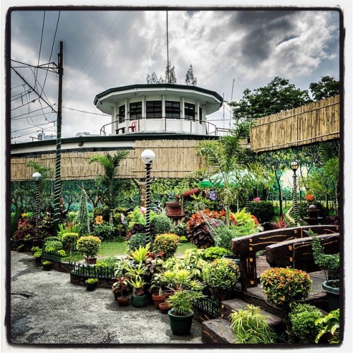 clarkegiles: #Philippine #Prison #landscape -a guard tower looks over a well-tended #garden kept up 