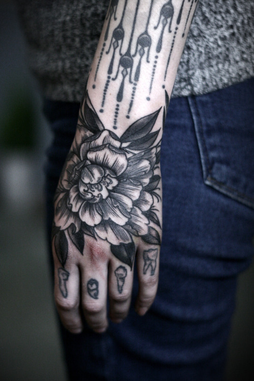 Wrapping peony on the hand by Sean Wright