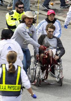 storythatcontinues:  youchangetheworld: The man in the cowboy hat in this photo’s name is Carlos Arredondo. Carlos was at the Boston Marathon with his wife handing out American flags to runners. He lost a son to a sniper bullet in Iraq in 2004 and a
