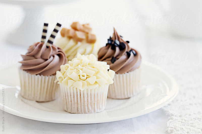 undercovercupcake:  (via Chocolate cupcakes on a plate by Ruth Black - Stocksy United