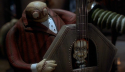 i-alwayslikedstrangecharacters:   A citizen of Halloween Town, he is a member of the town band. He doesn’t talk much, but the corpse inside his coffin bass does.   
