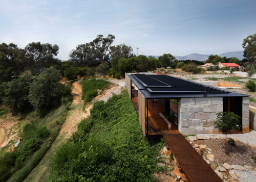 throughjo: …the family house of Sculptor Benjamin Gilbert on a former gold mine and sawmill, using reclaimed concrete blocks and rough-sawn macrocarpa wood…  Sawmill house by Archier 