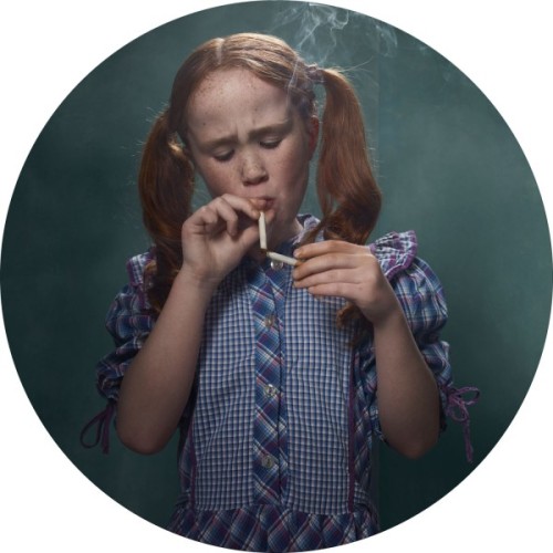 conveyerofcool:   Cool Photography: Smoking Kids Photographer Frieke Janssens poses young children with cigarettes. “I wanted to isolate the viewer’s focus on the issue of smoking itself. I felt that children smoking would have a surreal impact upon