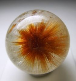 ggeology:  Orange Rutile starburst in Quartz