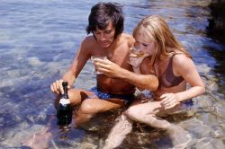 the60sbazaar:  Footballer George Best and his girlfriend Susan George on holiday in Spain (1969)
