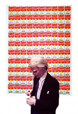  Andy Warhol in front of 100 Cans 1962
