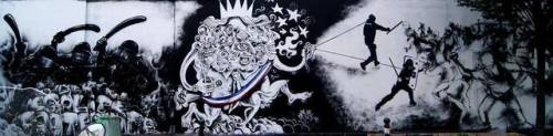 Huge murals seen around Paris in recent months, painted by the radical street art collective Black L