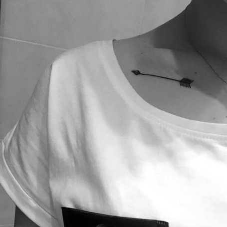 cutelittletattoos: Little clavicle tattoo of an arrow.