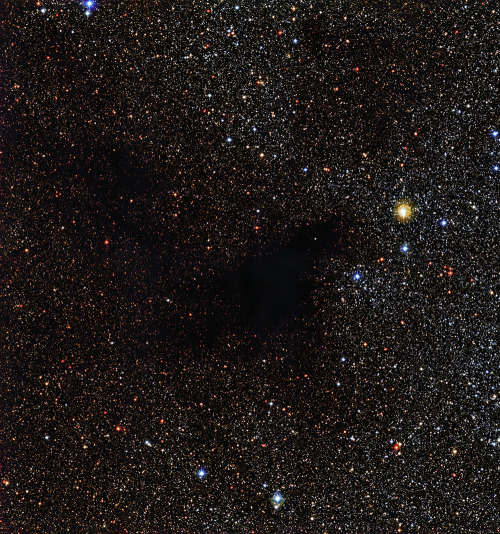 sci-universe: This new image from European Southern Obervatory shows a mystical dark void in the middle of all the stars. It’s actually a cloud filled up with gas and dust, and such regions are the birthplaces of future stars! The cloud is called