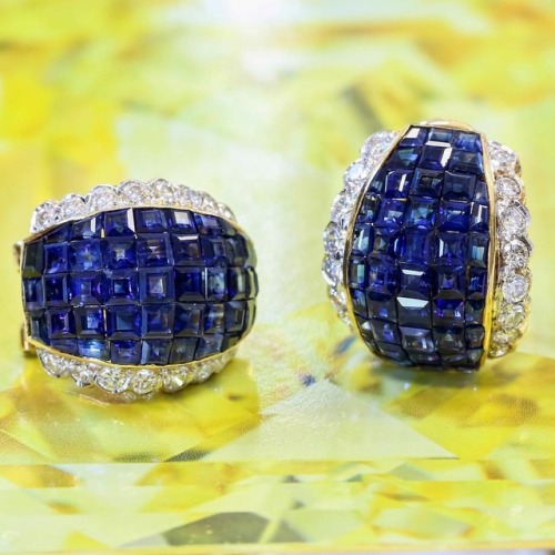 Pair of sapphire and diamond ear clips featuring invisibly-set sapphires. Lot 326 in the upcoming au