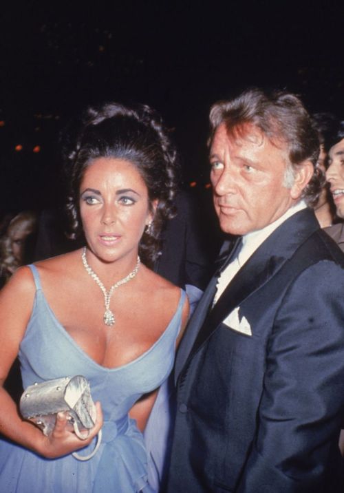 voguefashion: Elizabeth Taylor wearing a periwinkle and violet chiffon gown designed by Edith Head, 