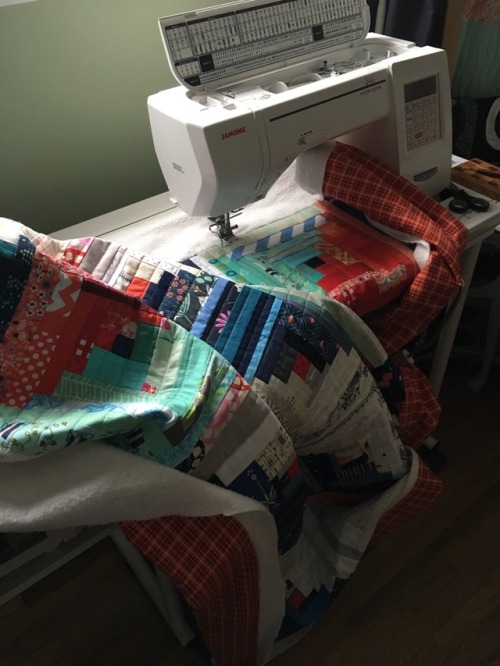 Log cabin quilting: This week, I finished quilting my log cabin scrap quilt. I decided on straight l