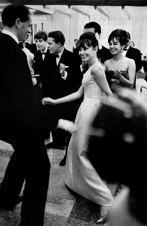 Audrey Hepburn, doing the twist with her husband, Mel Ferrer; at a charity ball aboard the new ocean