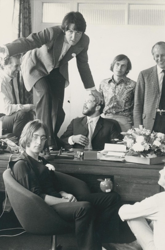 John Lennon And Paul McCartney With Beatles Associates (Peter Brown, Derek Taylor, Neil Aspinall) In