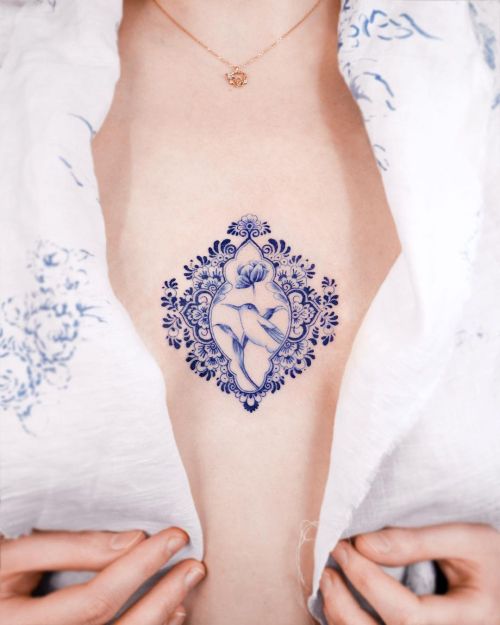 ig: e.nal.tattoo bird;blue;chest;flower