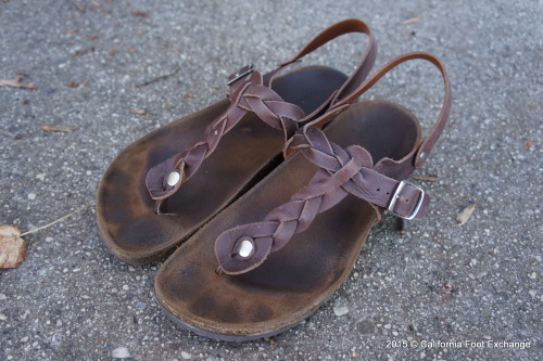 Well worn feet print having sandals.