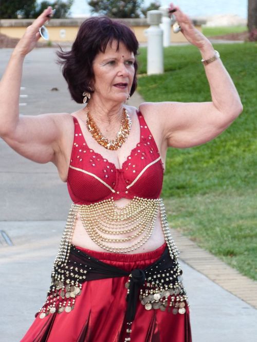 Confident women dancing during mental health awareness week in Townsville at The Strand. Photography