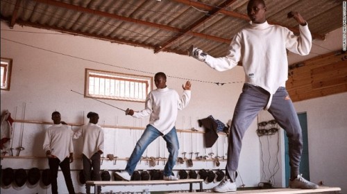 modernfencing:[ID: two foilists practicing on short balance beams.]Fencers from a program in Senegal