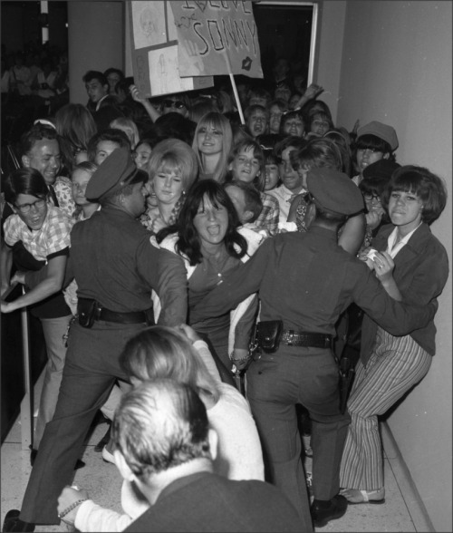 Teens, 1965Police try to hold back part of 1,000 teenagers who broke through cordon at Los Angeles  