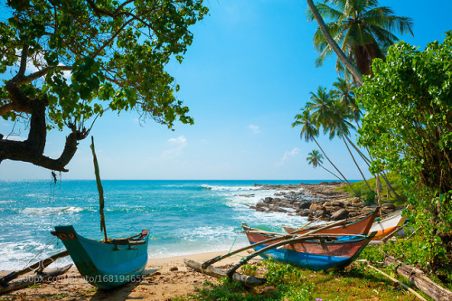 Boats on a beach at Sri Lanka by antongvozdikov