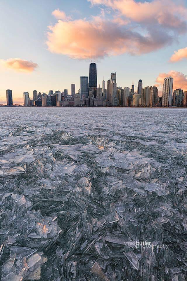 sixpenceee:  Ice crystals forming on a lake in Chicago. Photographer is Barry Butler. Check