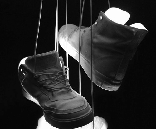 awesomeshityoucanbuy:  Hanging Shoes LampIt’s a common sight in any urban sprawl, but we guarantee you’ve never seen a shoe toss quite like this lamp. Inspired by the ubiquitous landmark, the lamp dangles off a telephone pole while lighting up the