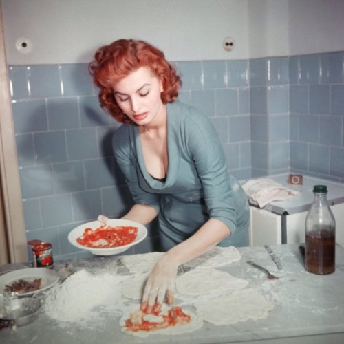 Sophia Loren is making us all a delicious pizza.  Yum!