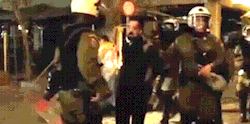  December 6 2014 - Handcuffed protester gets punched by a riot cop during the demonstration for Nikos Romanos and Alexis Grigoropoulos [video] 
