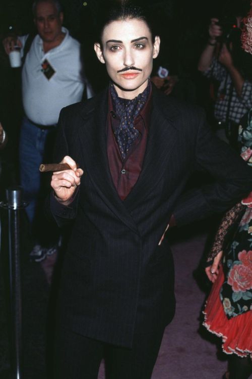 flashback-to-the-90s: Demi Moore dressed as Gomez Addams at a Halloween Event.
