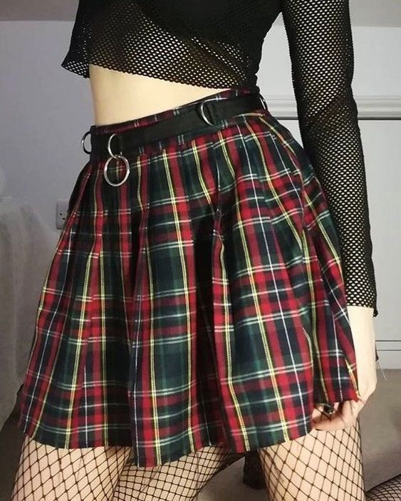 pleatedminiskirts:  A lovely tartan miniskirt with some fishnet tights and a mesh
