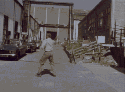 gameraboy:  Harrison Ford practicing with a whip on the backlot for Raiders of the Lost Ark. 
