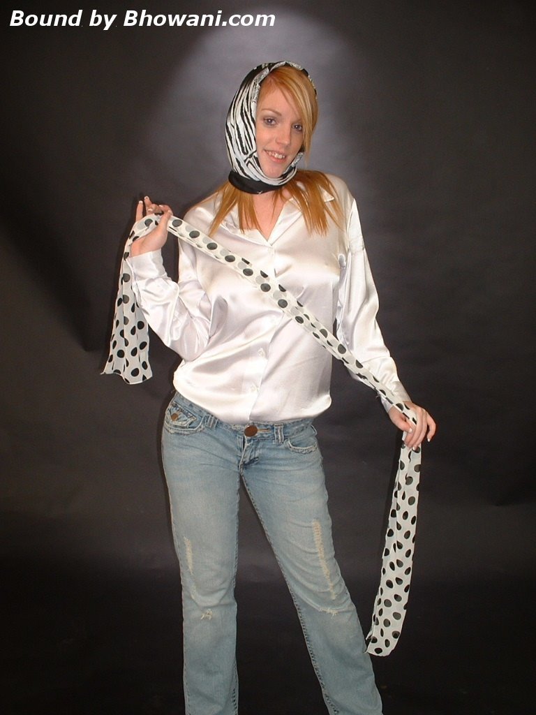 graybandanna:  A headscarfed Fi Stevens gags herself with 2 more scarves 