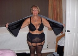 This fat granny looks absolutely ravishing in her black lingerie!