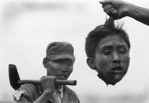 losed:  A member of the South Korean National Police holds the severed head of a North Korean communist guerrilla during the Korean War, 1952 photo by Margaret Bourke-White 