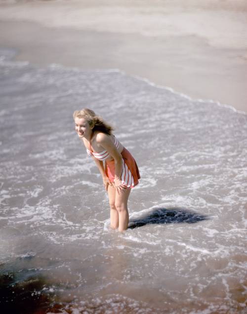 Marilyn Monroe, then known as Norma Jeane, on the beach in Los Angeles, California, 1946. Photo by R