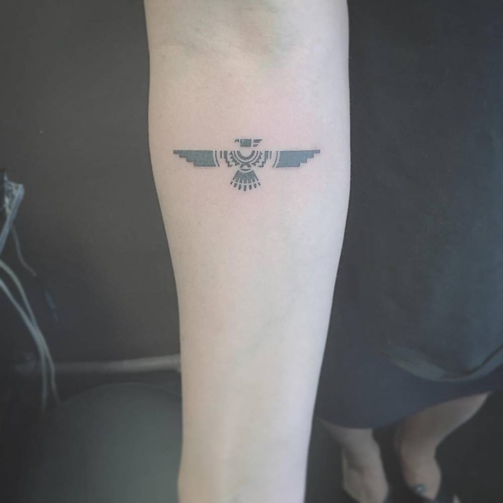 Classic eagle tattoo design on forearm, black and white ink on Craiyon