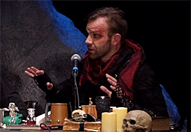 arocalebwidogast:[ID: Liam O'Brien and Sam Riegel at GenCon 2019, roleplaying as Caleb Widogast and 