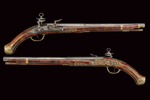 An ornate pair of miquelet pistols originating from Italy.  Signed “C.A. Feretti”, 18th 