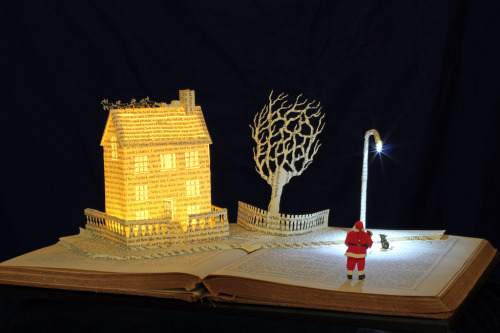 A visit from St. Nicholas (‘Twas the night before Christmas) book sculpture by Justin Rowe. On