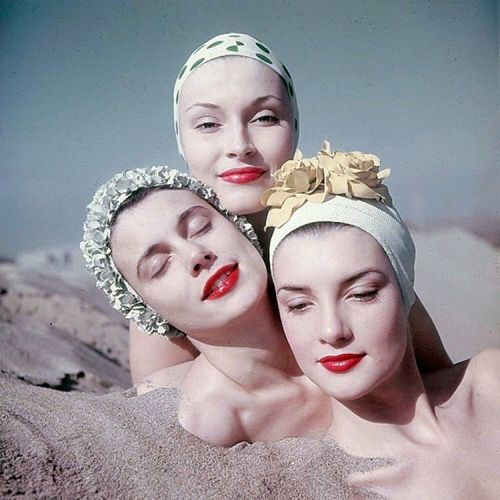 life: Three women modeling the latest in swim cap fashion in 1950, California. (Loomis Dean—Th