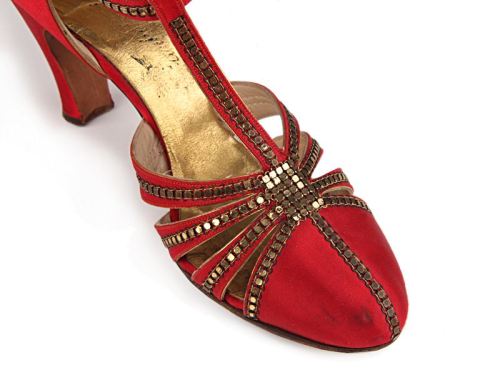 Red satin T-strap shoes decorated with metallic gold color rivets.Frank Brothers Footwear Inc.USA. c