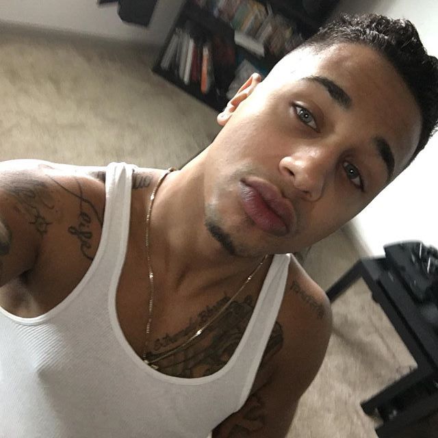 dominicanblackboy:  A cute moment wit Sexy tatted blue eyed rican Blu Rose and that