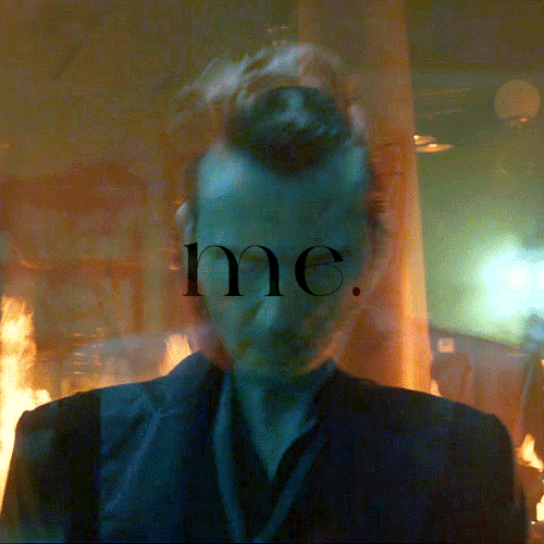 Gif 7/7: Two semi-transparent layers, one with an orange and one with a cyan undertone. First: Crowley walking with a stern and determined look in his eyes. Second: Crowley standing in the burning bookshop. In the middle, it says: "Me."