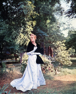 myvintagevogue:  Model wearing gown by Ben Reig, stole by Revillon 1954
