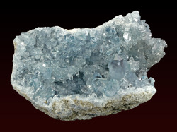 fuckyeahmineralogy:  Celestine geode; Sakoany deposit, Mahajanga Province, Madagascar Celestine (SrSO4) is mined for its strontium content, which is used in pyrotechnics to provide a red color.  It is commonly found in geodes, and the largest geode in