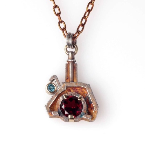 7H Pendant, Machina Collection. Sterling Silver, 18ct yellow gold, 1.6ct garnet, topaz. Height: 2.5c