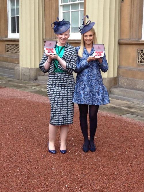 Alpine skiier Kelly Gallagher and her guide Charlotte Evans collect their MBEs at Buckingham Palace.