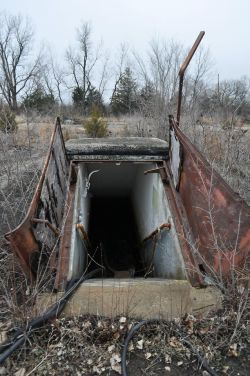 destroyed-and-abandoned:  Doors leading underground into an abandoned Nike missile silo Source: Creeping_Deth (reddit)