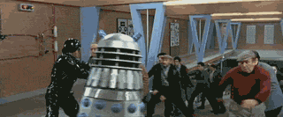 kwmurphy:  lunchbot1:  My favorite bit from the RiffTrax of the second Dr. Who movie: Daleks’ Invasion Earth 2150 A.D.  Big, dumb, Englishy as all Hell, funny where it isn’t supposed to be and unfunny where it is.  It’s as if a local theatre company
